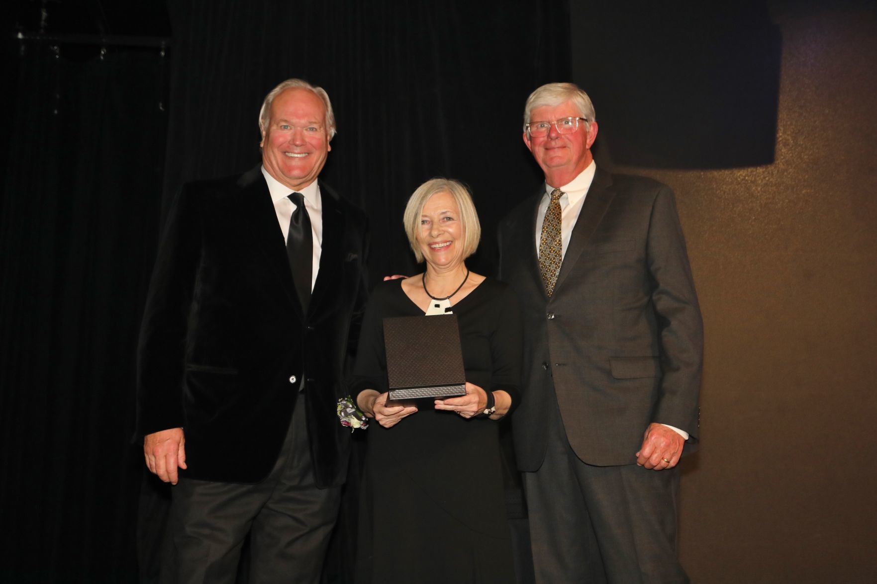 Dick Miles, Chairman of the Board, Cynthia Russell, daughter of late father Willard Boyle, honoree, Bob Bishop, chair of induction committee and board member
